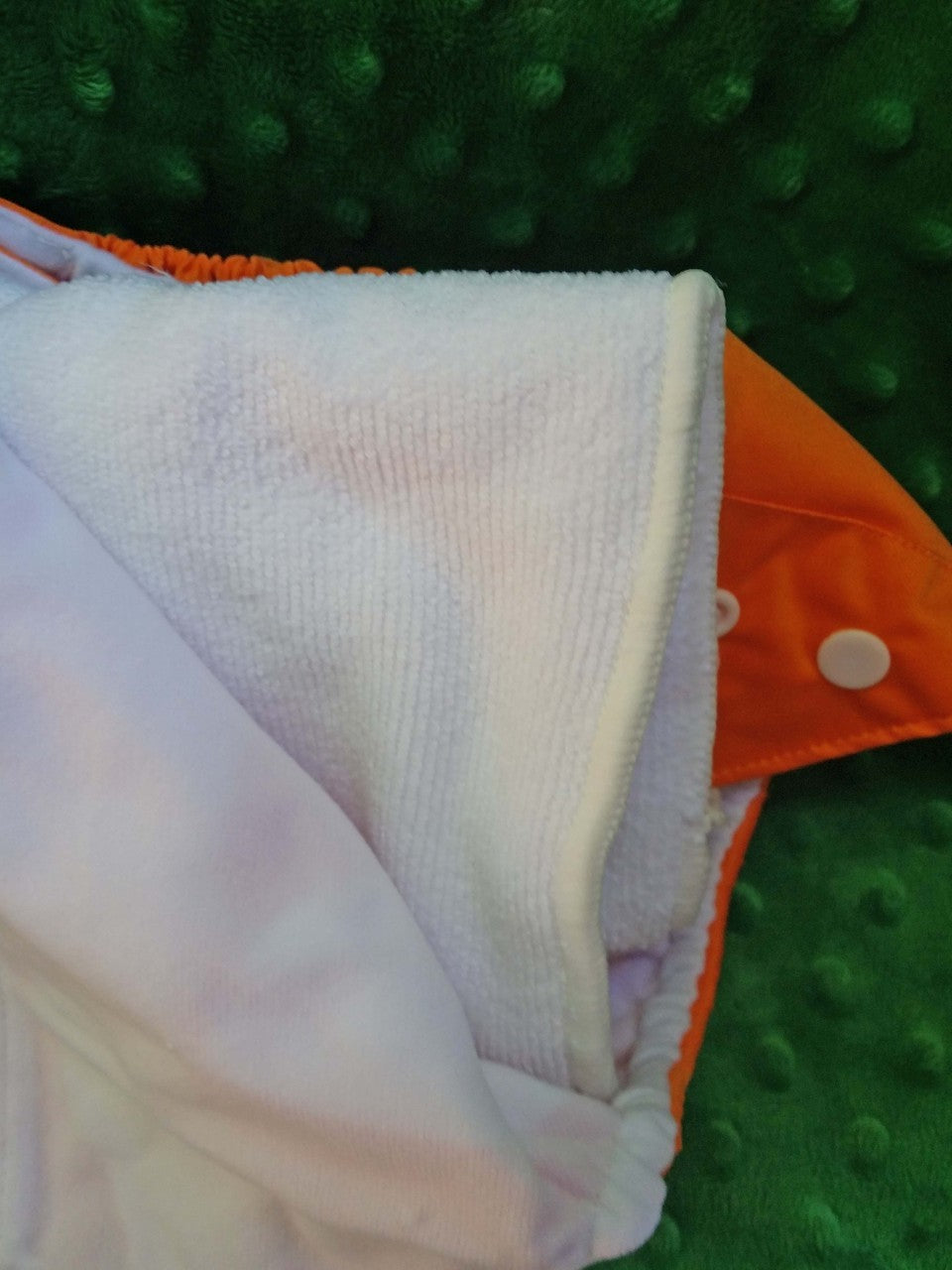 Close-up of a textured fabric with a green background