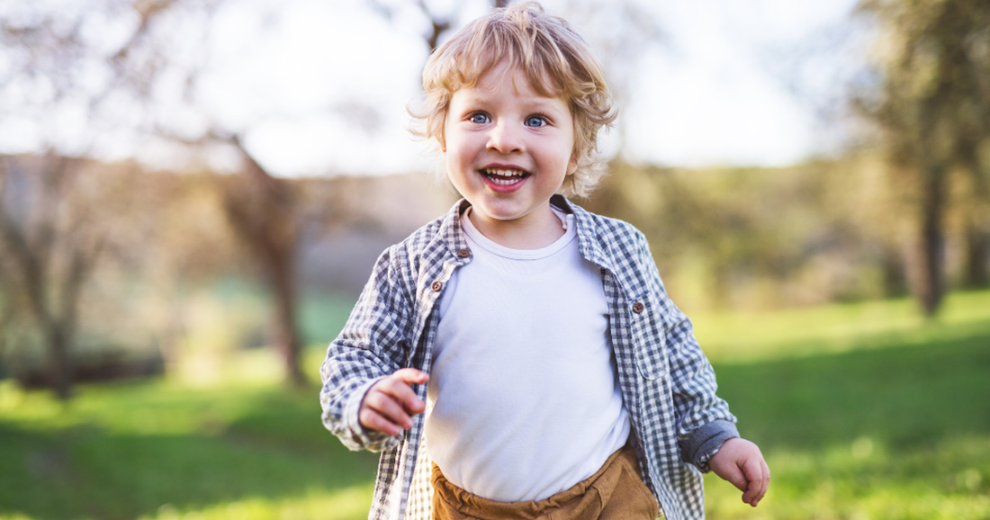 child happily running in park