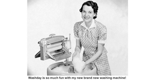 woman happy with old fashioned washing machine