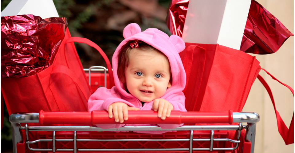 Shopping cart with baby during a sale