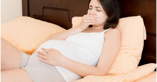Pregnant woman holding her stomach