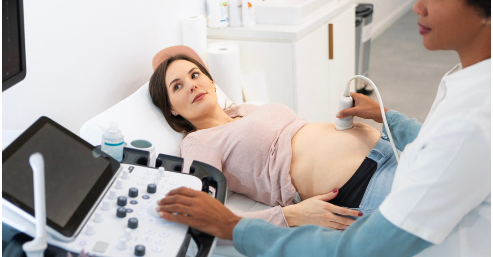 Pregnant woman having blood drawn for NIPT prenatal screening.