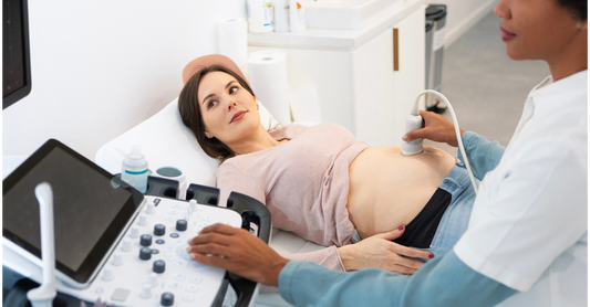 Pregnant woman having blood drawn for NIPT prenatal screening.