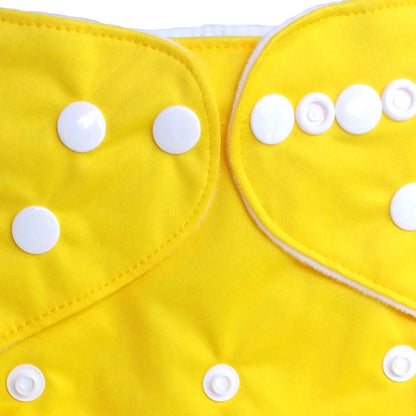 Yellow fabric with white buttons on a white background