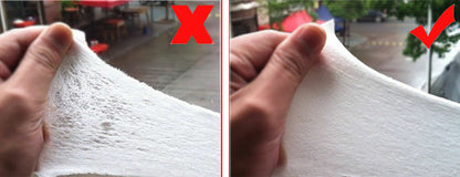Comparison of two pieces of white bamboo nappy liners by hands, with a red 'X' and check mark indicating quality.